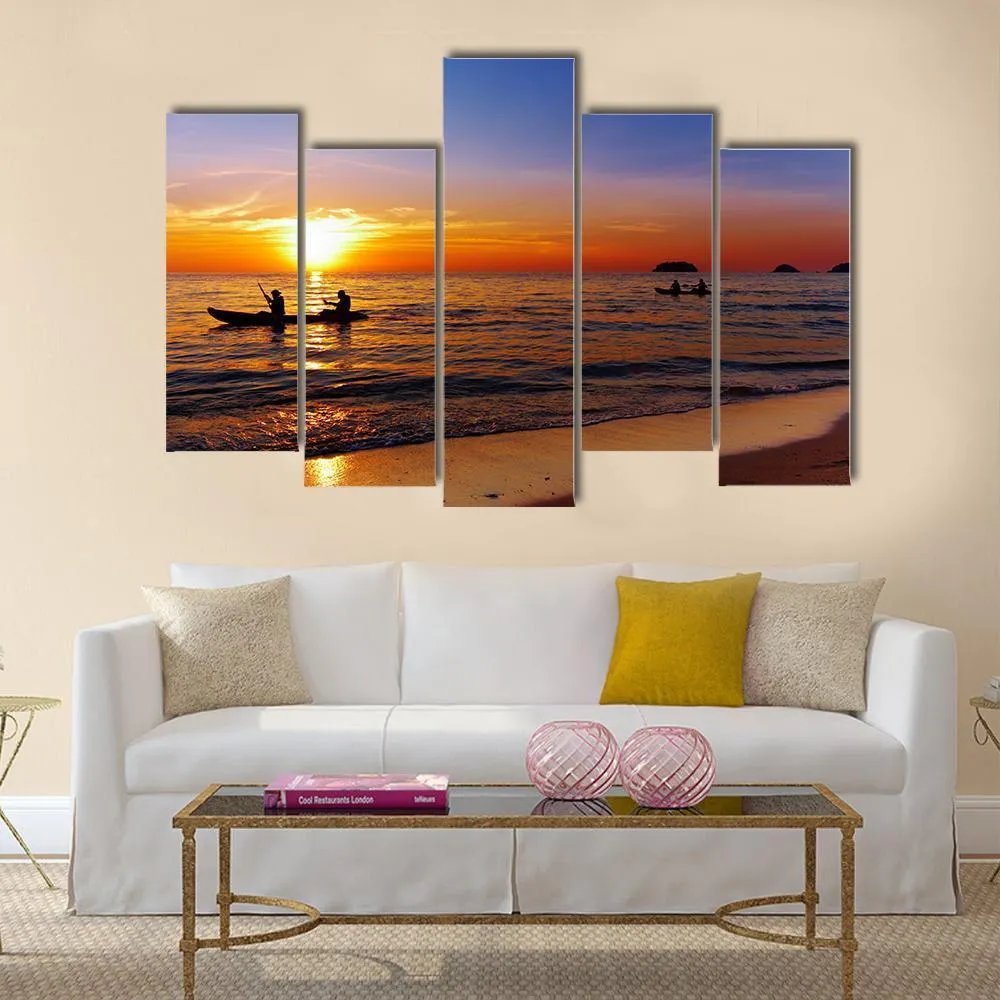 Kayakers At Sunset Canvas Wall Art