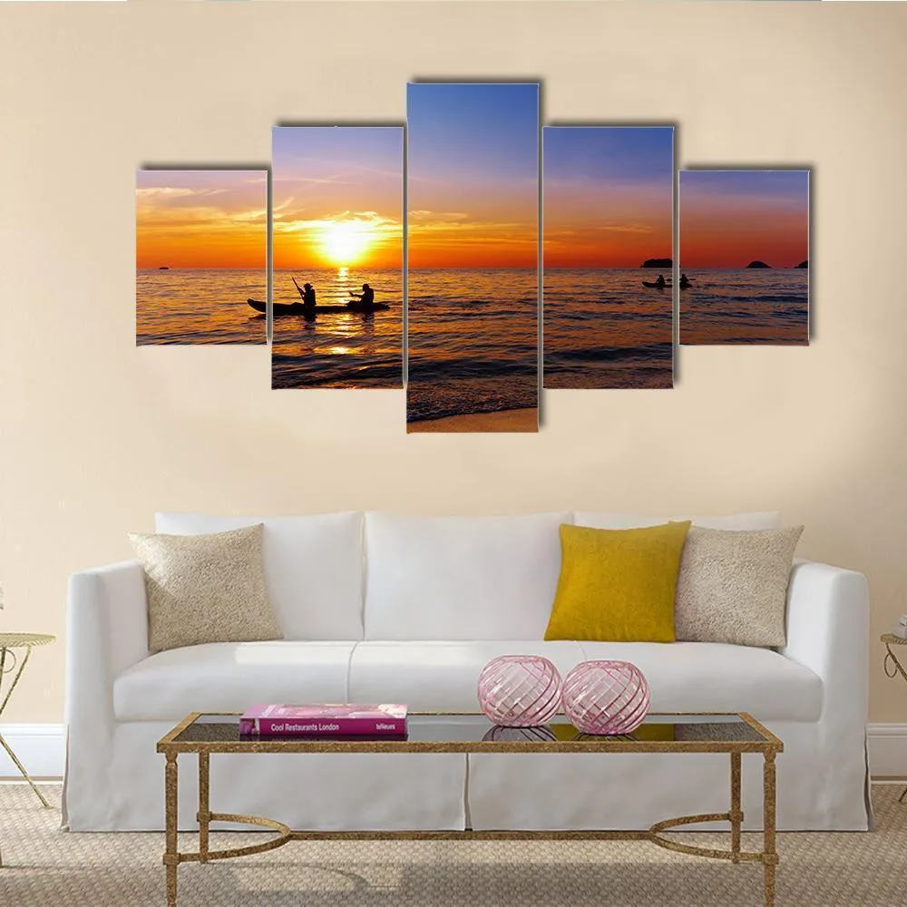 Kayakers At Sunset Canvas Wall Art